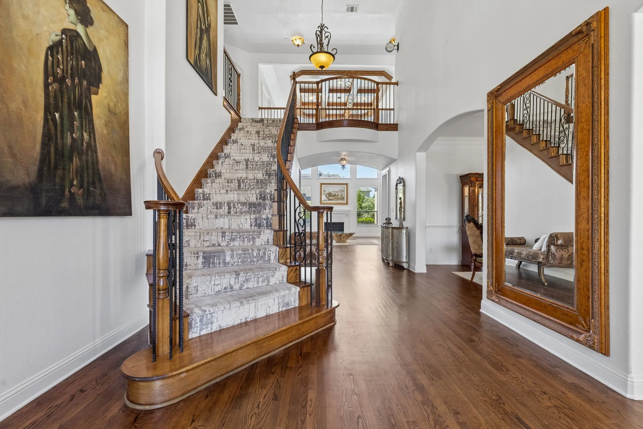 1 of 2 this grand staircases creates the WOW factor as you enter the home!