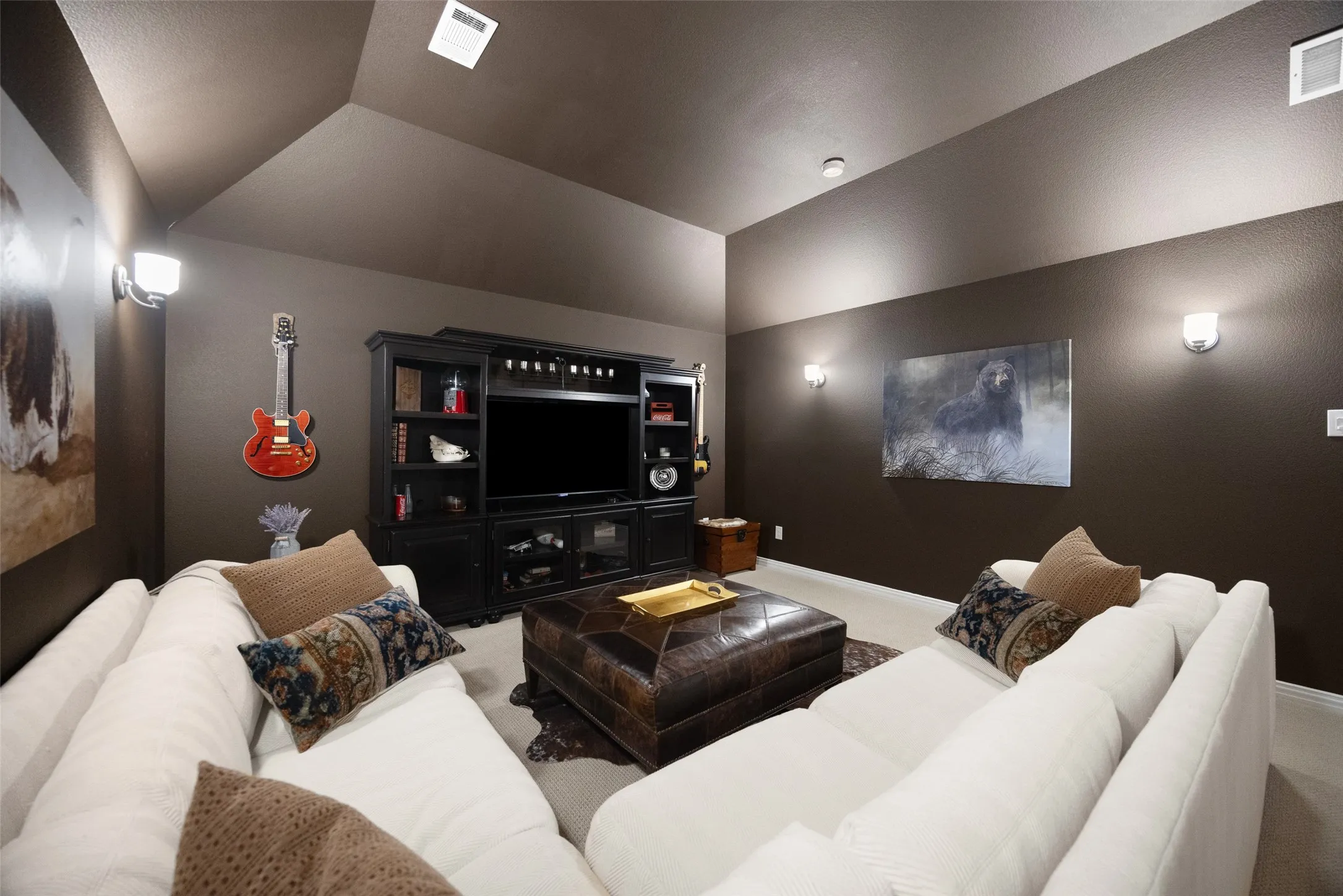 Color-drenched media room features bar and wine fridge