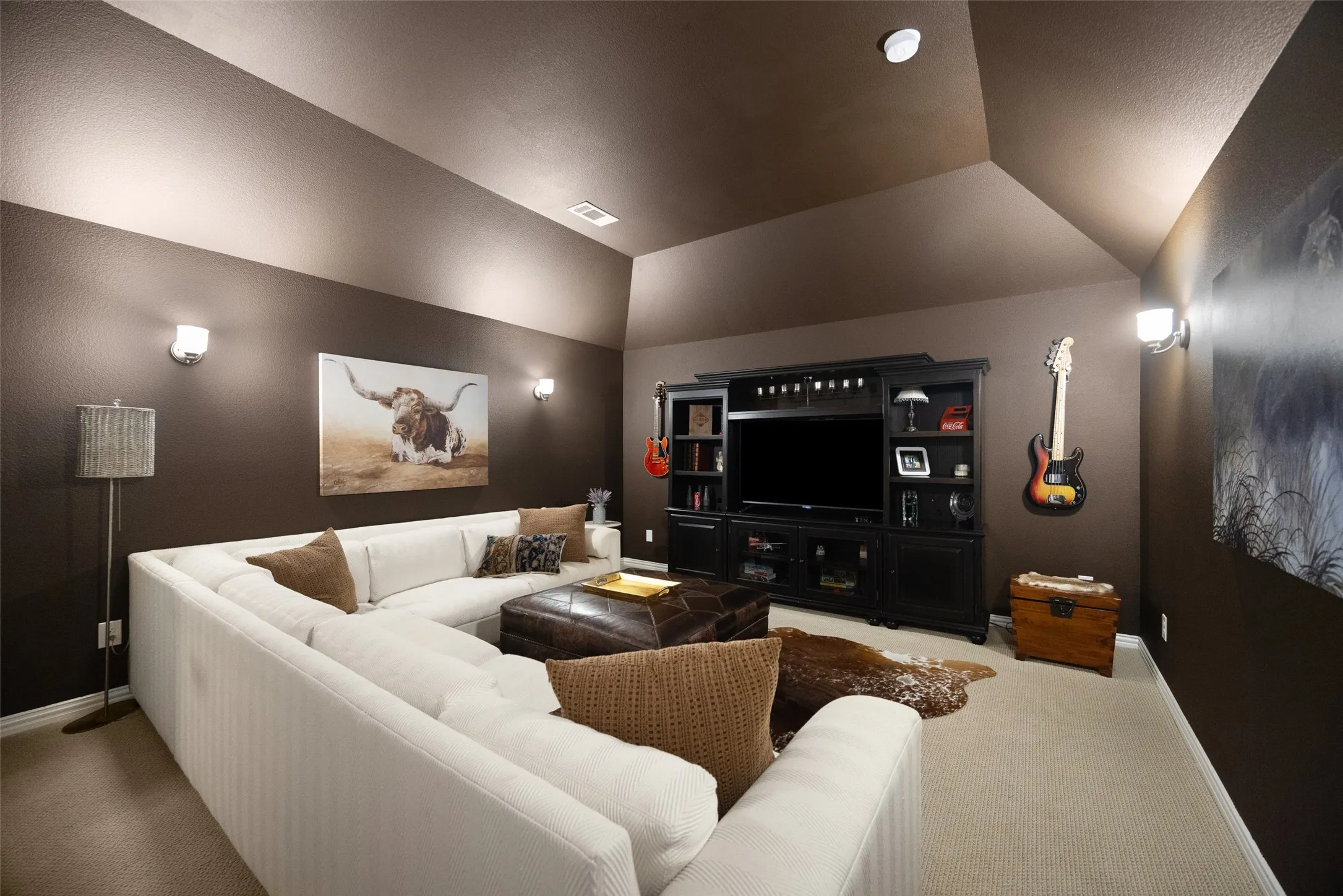Color-drenched media room features bar and wine fridge