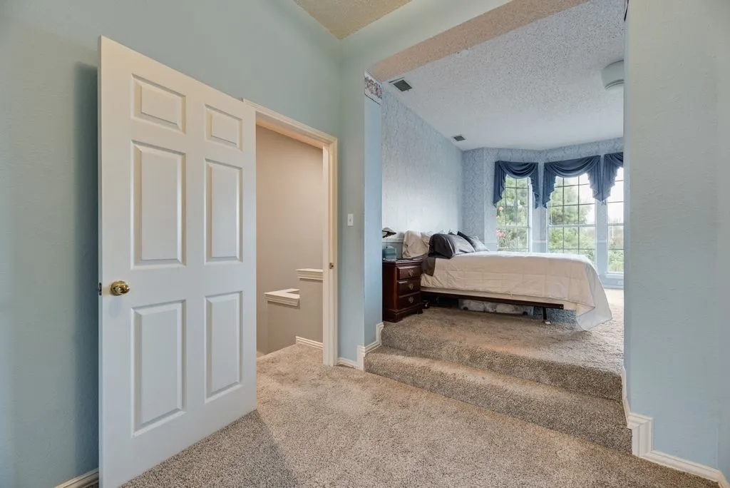 Step up to the primary bedroom suite