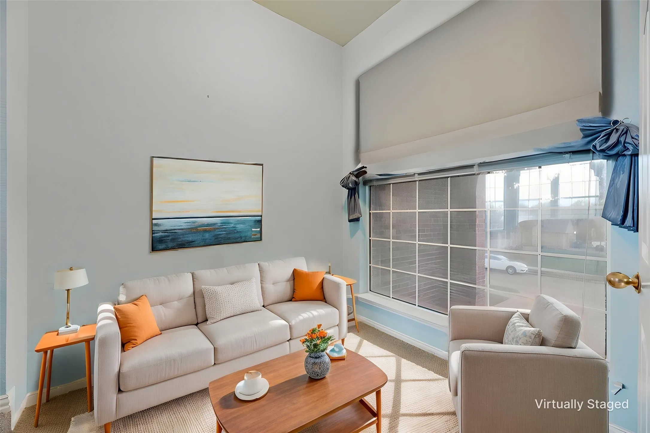 Virtually staged sitting area by primary suite