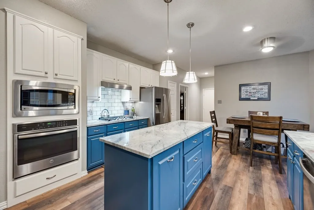 Stainless appliances and refrigerator remains