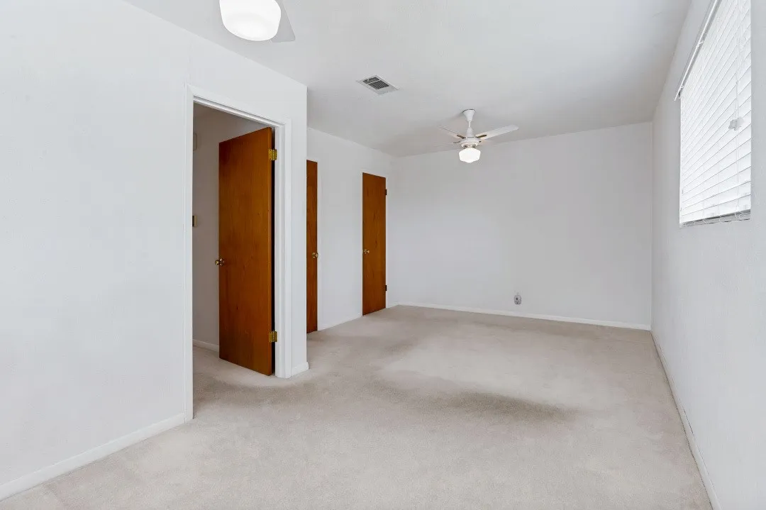 Primary bedroom with 2 walk-in closets