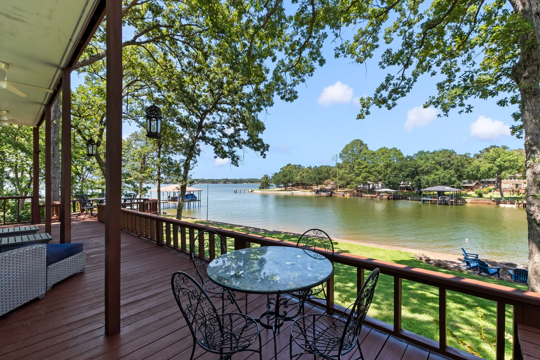 Expansive deck stretches across the back of the home. Generous space between neighboring homes.