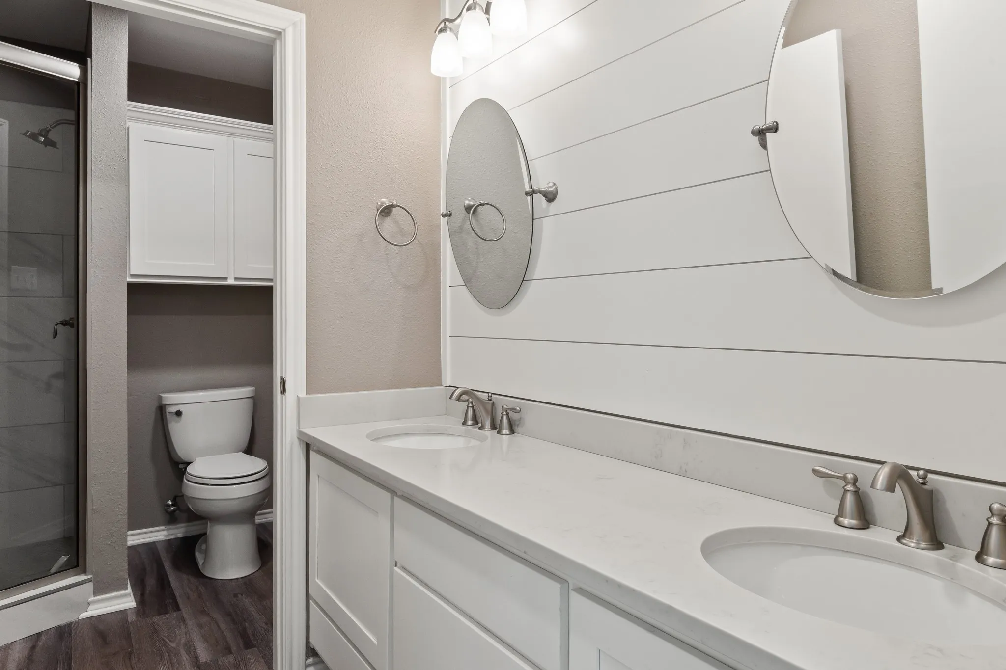 Dual Sink Vanity plus walk in tile shower.