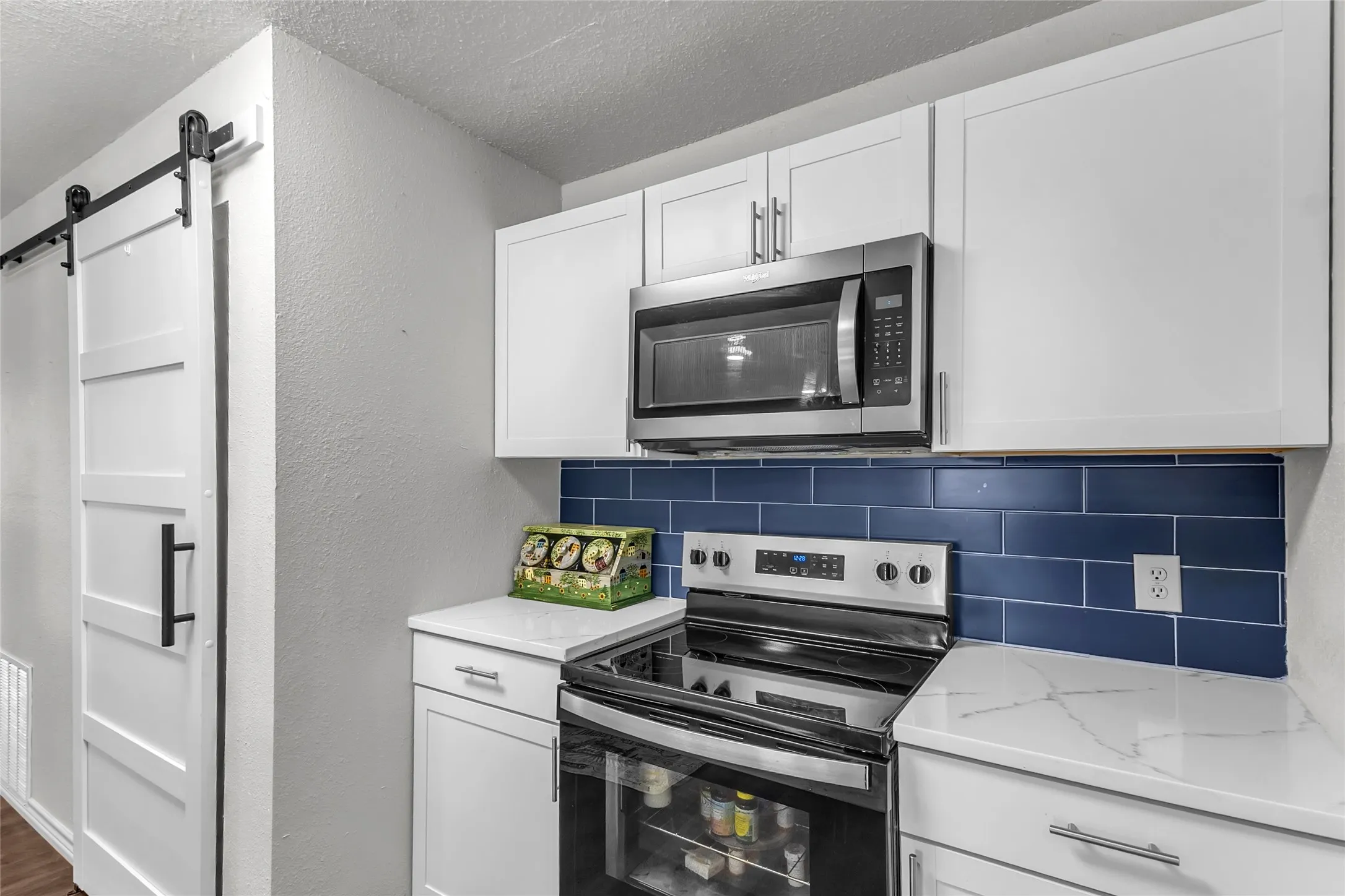 Barn Doors to Laundry-Pantry. Storage. New stacked Washer & Dryer plus Fridge are included in the sale
