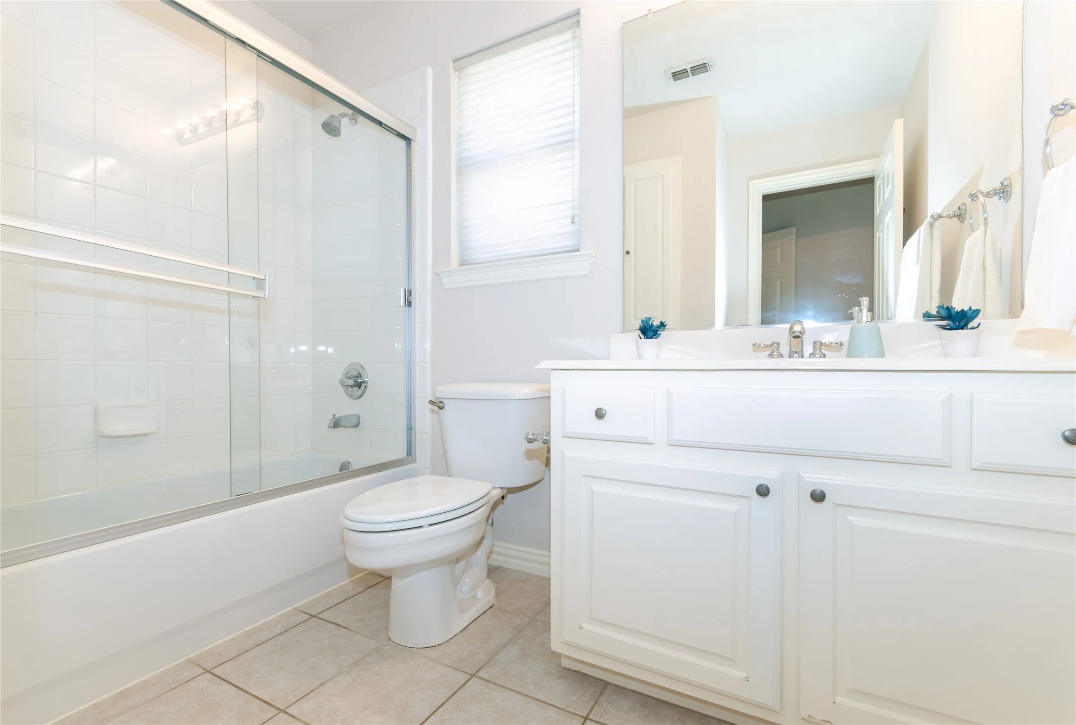Bathroom # 3 - White vanity featuring a built-in sink and ample storage cabinetry