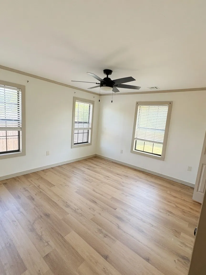 Large bedroom with ceiling fan