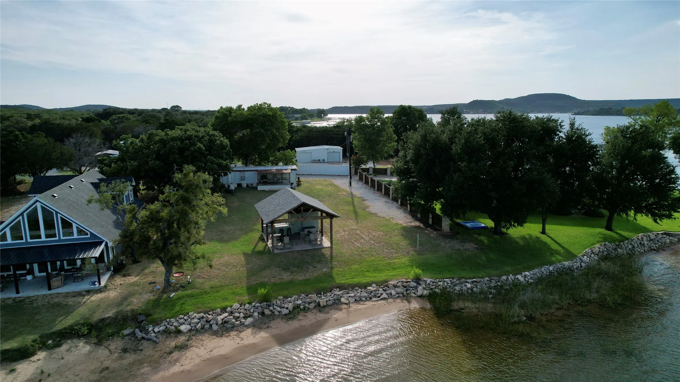 Mobile Home For Sale in Palo Pinto County , 1909 Buck Run, Graford, Texas 76449, 2 Bedroom, 1 Bathroom, Garage spaces, 728 Sqft, built in 1980, mls#21347450, Real Estate Agent in Graford, Homes For Sale in Palo Pinto county, Homes For Sale in Graford, Realtor in Graford Texas, Real Estate Brokerage Independent Realty Texas, Luminita Cordes Realtor