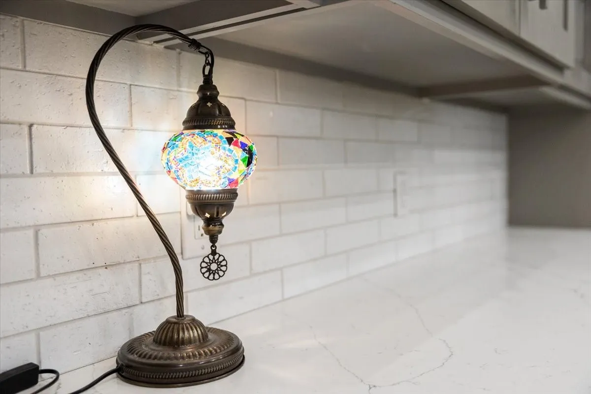 White subway tile backsplash with a light-toned countertop featuring subtle veining