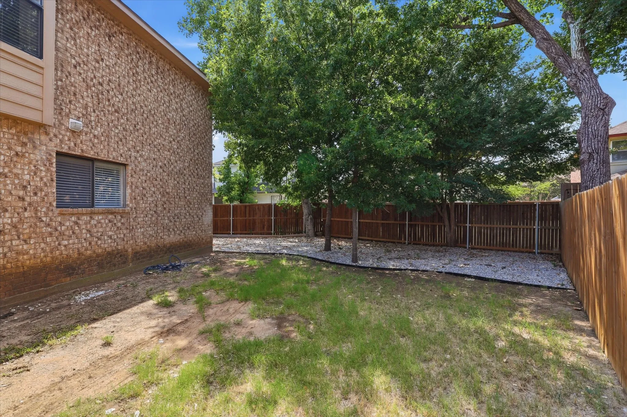 Spacious yard with new fence