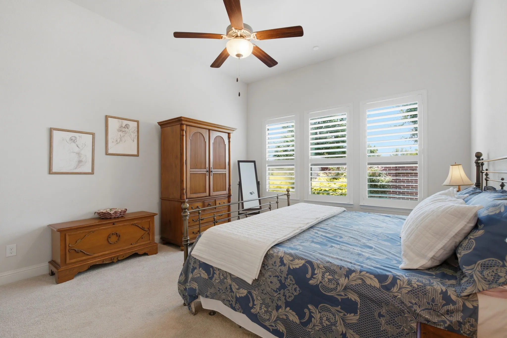 Lovely Primary Bedroom with Plantation Shutters, located separately from the other bedrooms