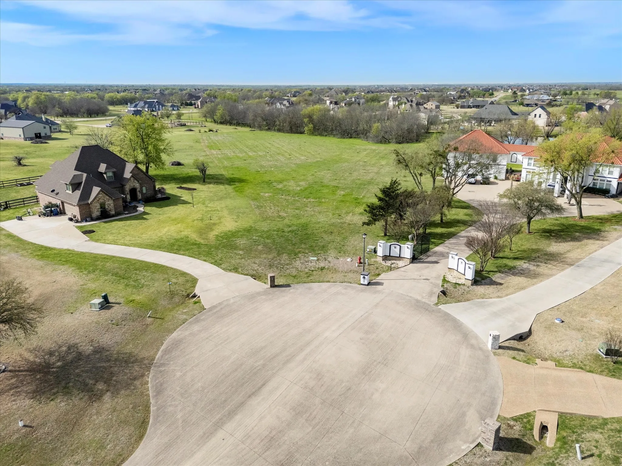 Expansive cul-de-sac with concrete paving and multiple entry points