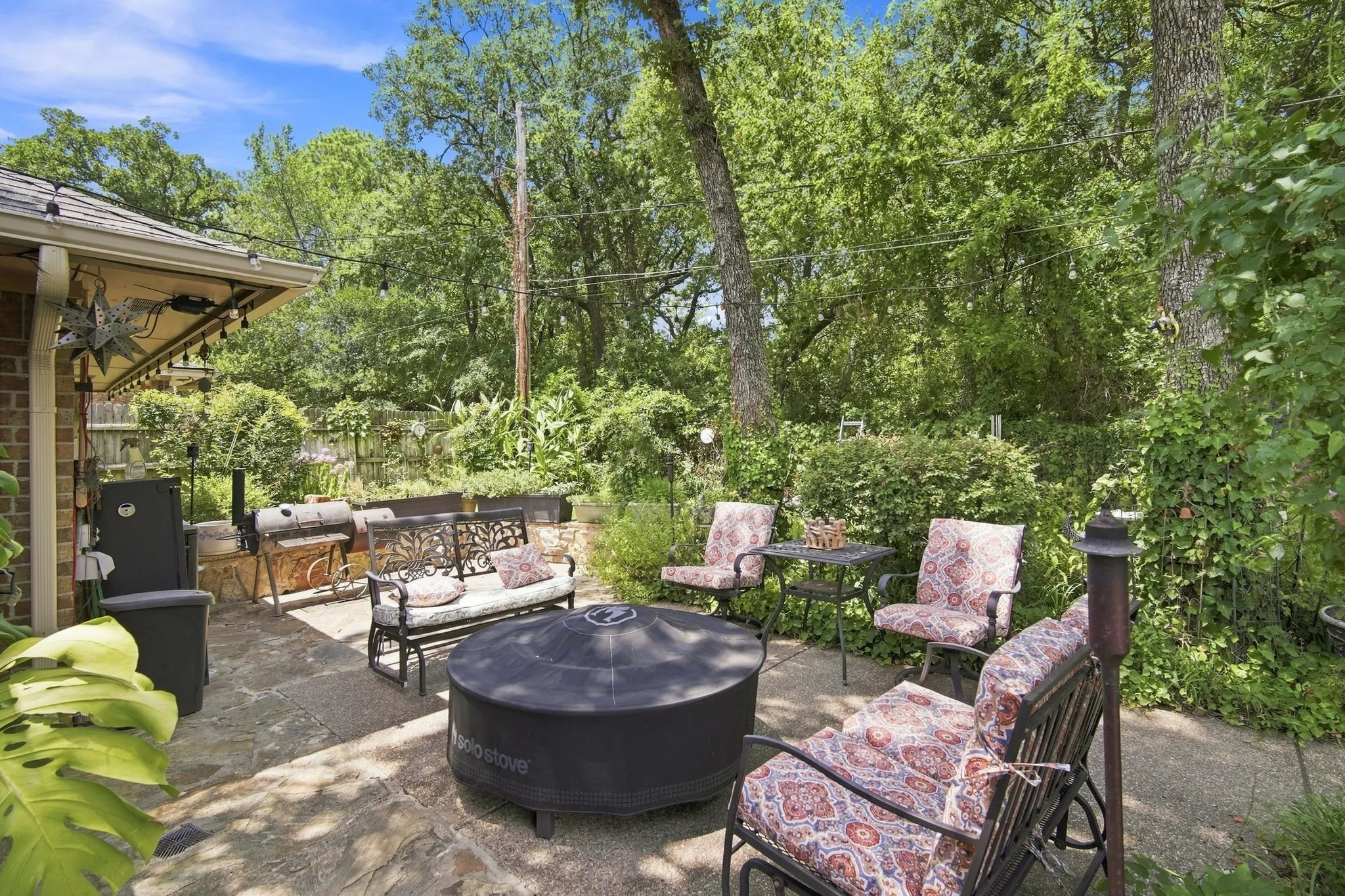 Expansive outdoor patio featuring flagstone paving