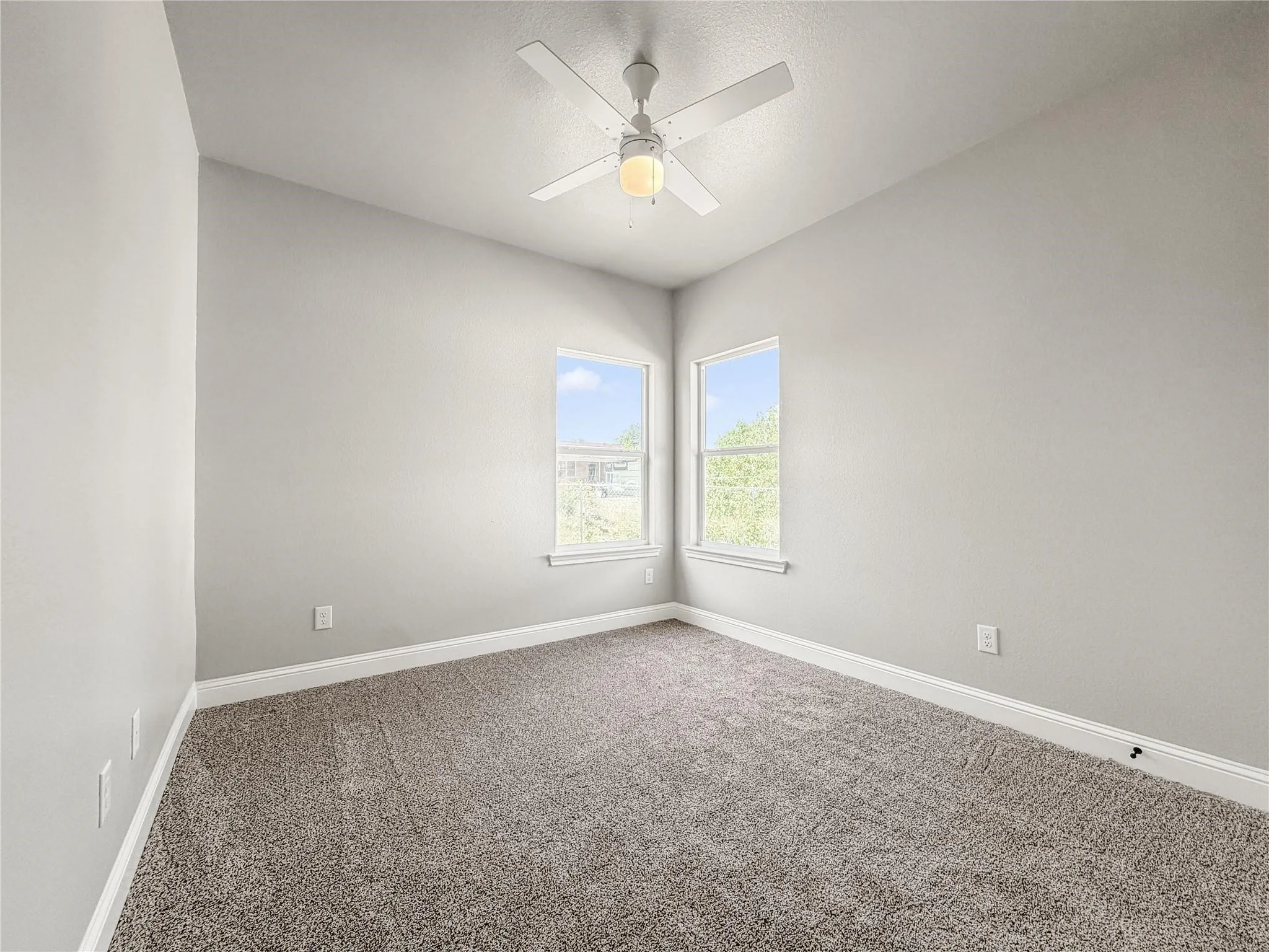 Open-concept living space featuring wood-finish flooring, recessed lighting, and a contemporary ceiling fan