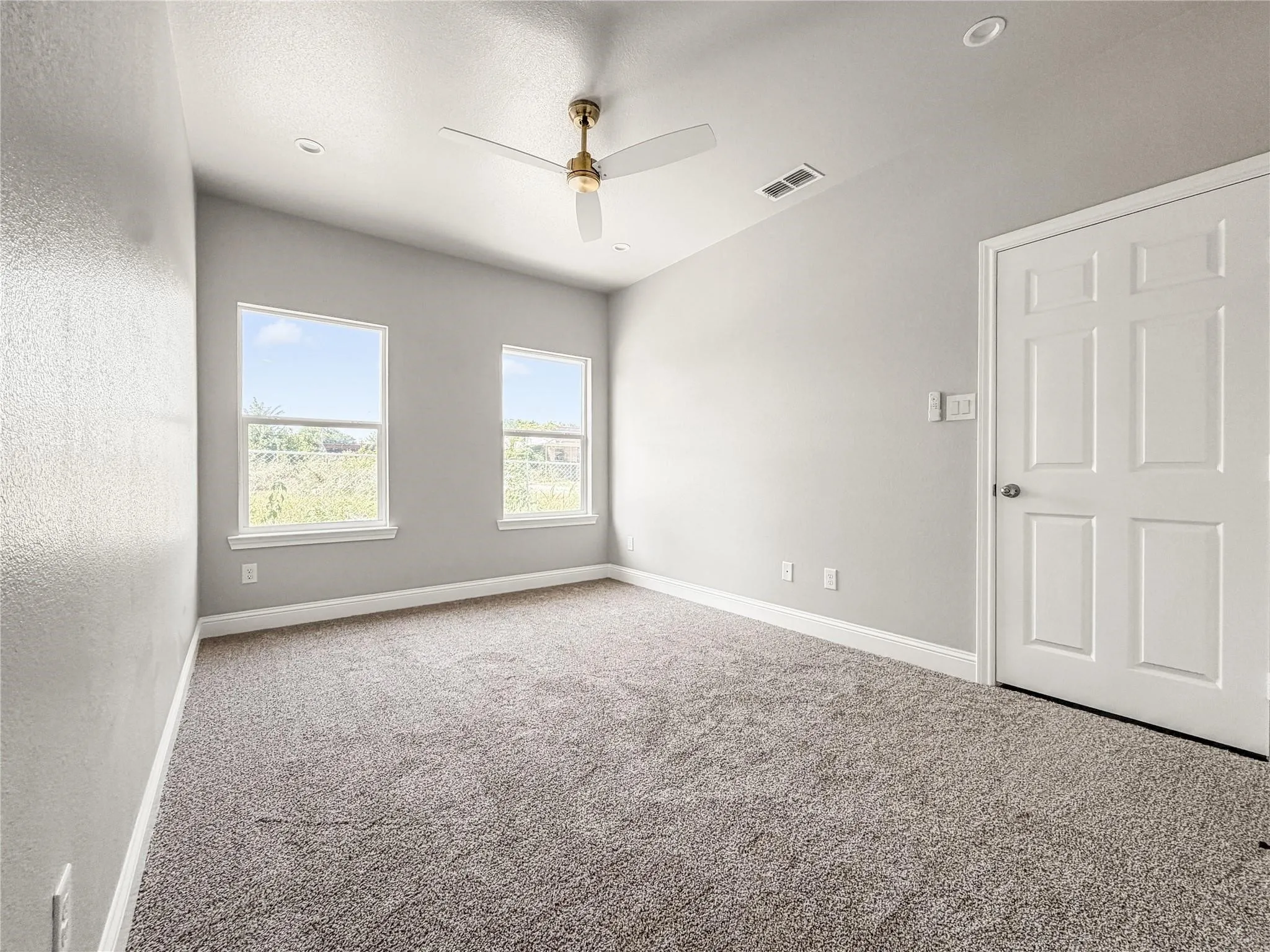 Open-concept living space featuring wood-finish flooring, recessed lighting, and a contemporary ceiling​​‌​​​​‌​​‌‌​‌‌​​​‌‌​‌​‌​‌​​​‌​​ fan