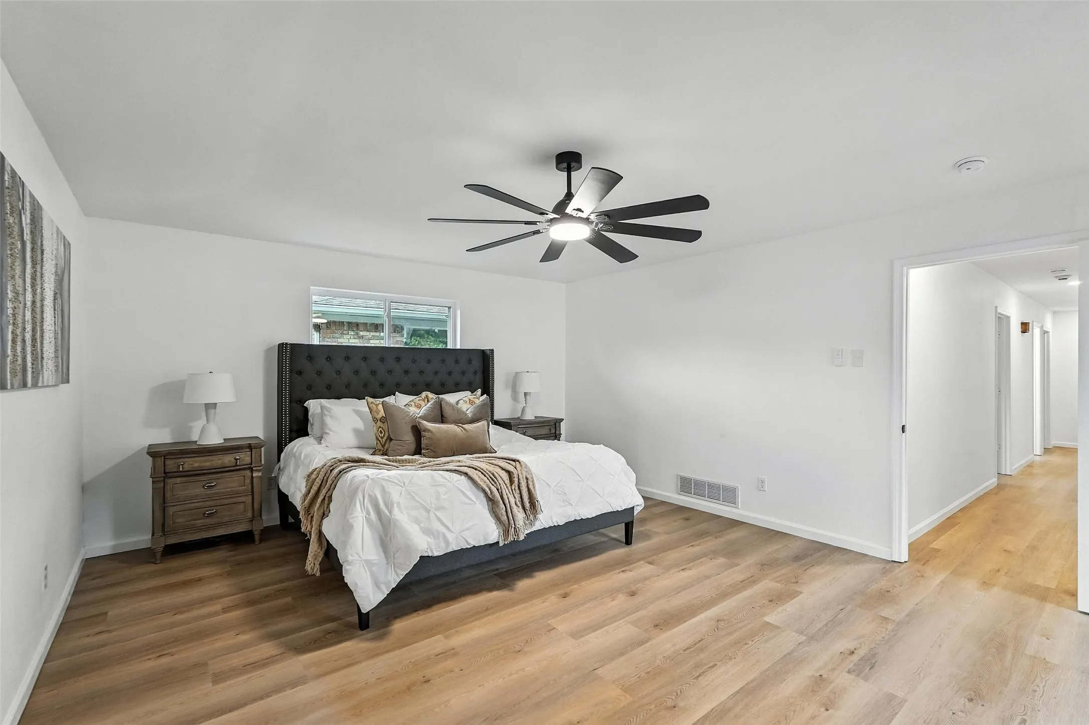 Bedroom with light wood-type flooring and ceiling fan