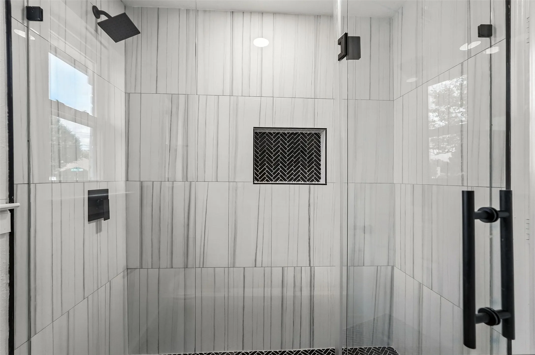 Bathroom featuring tiled shower