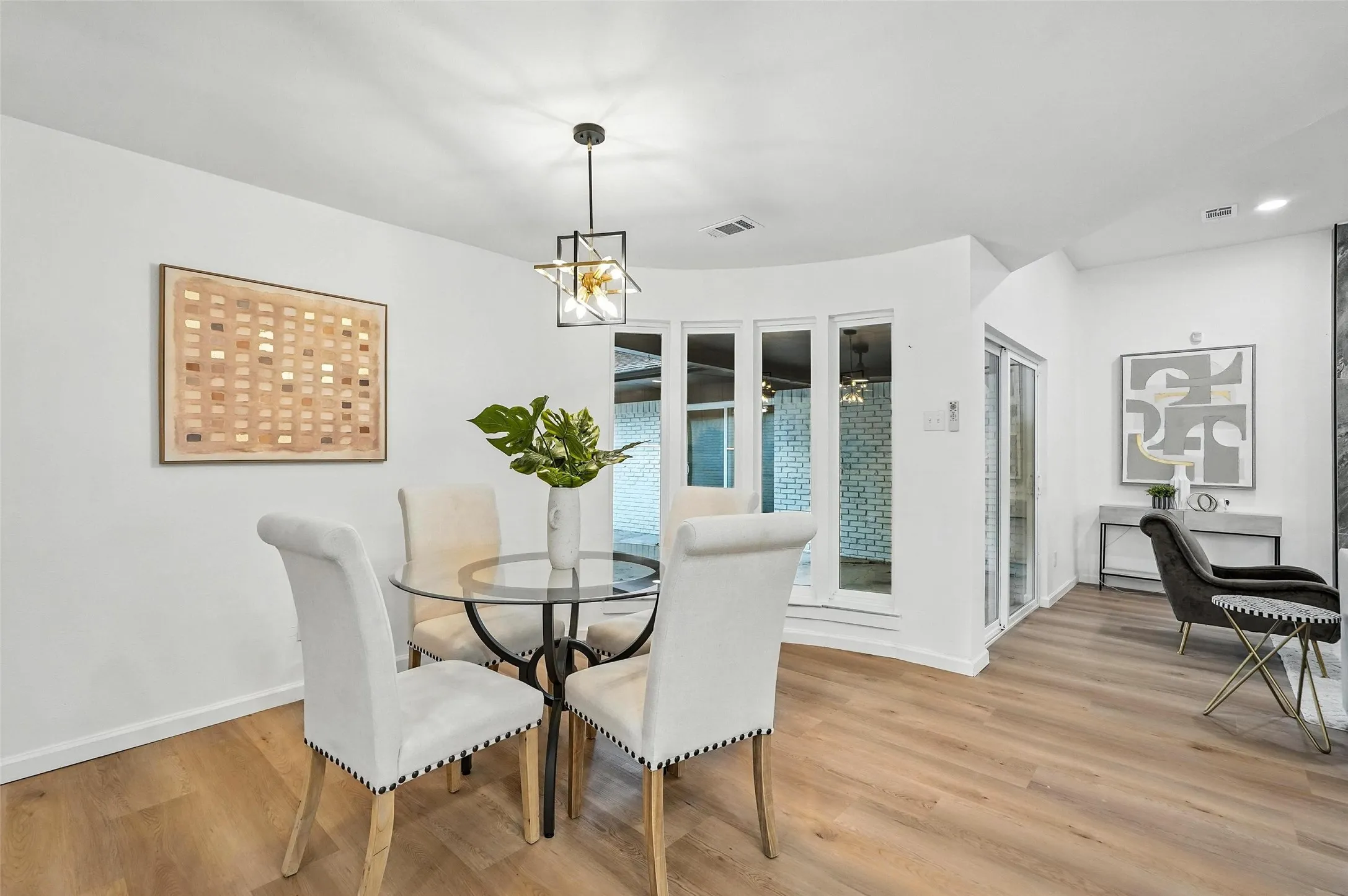 Dining area with light wood-style floors