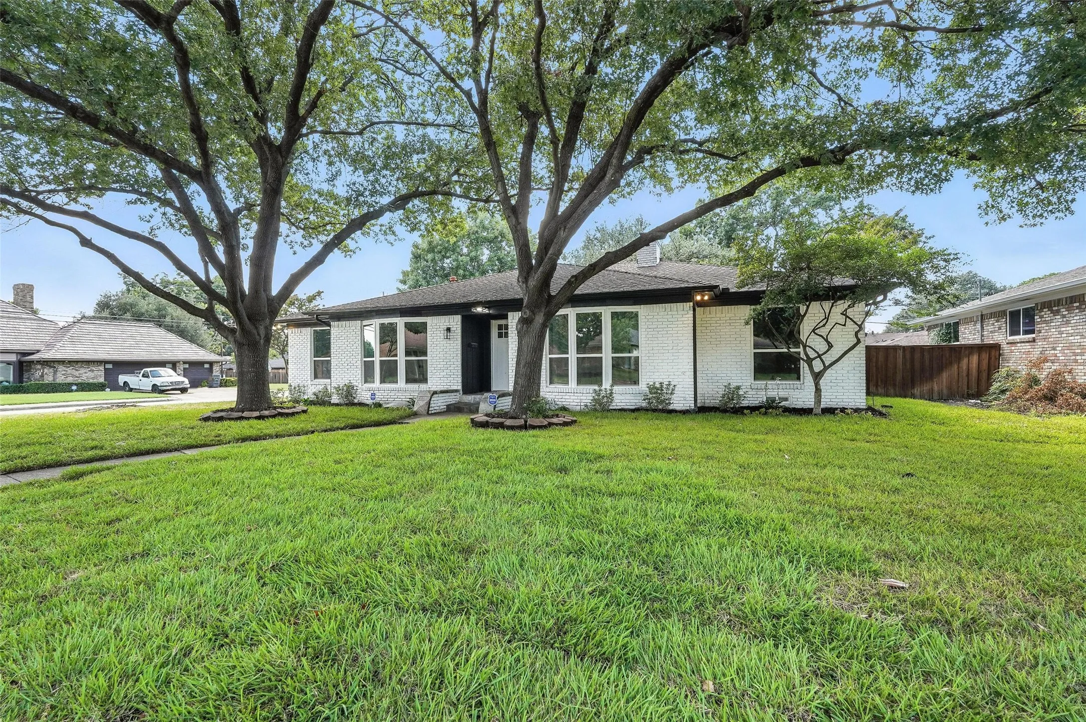 Mid-century home featuring brick siding