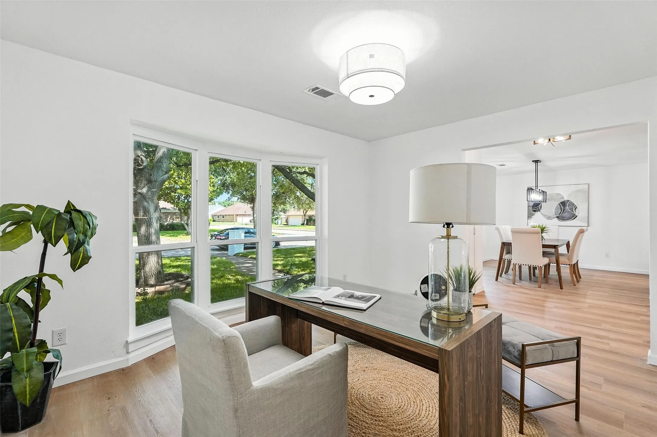 Home office with light wood-type flooring