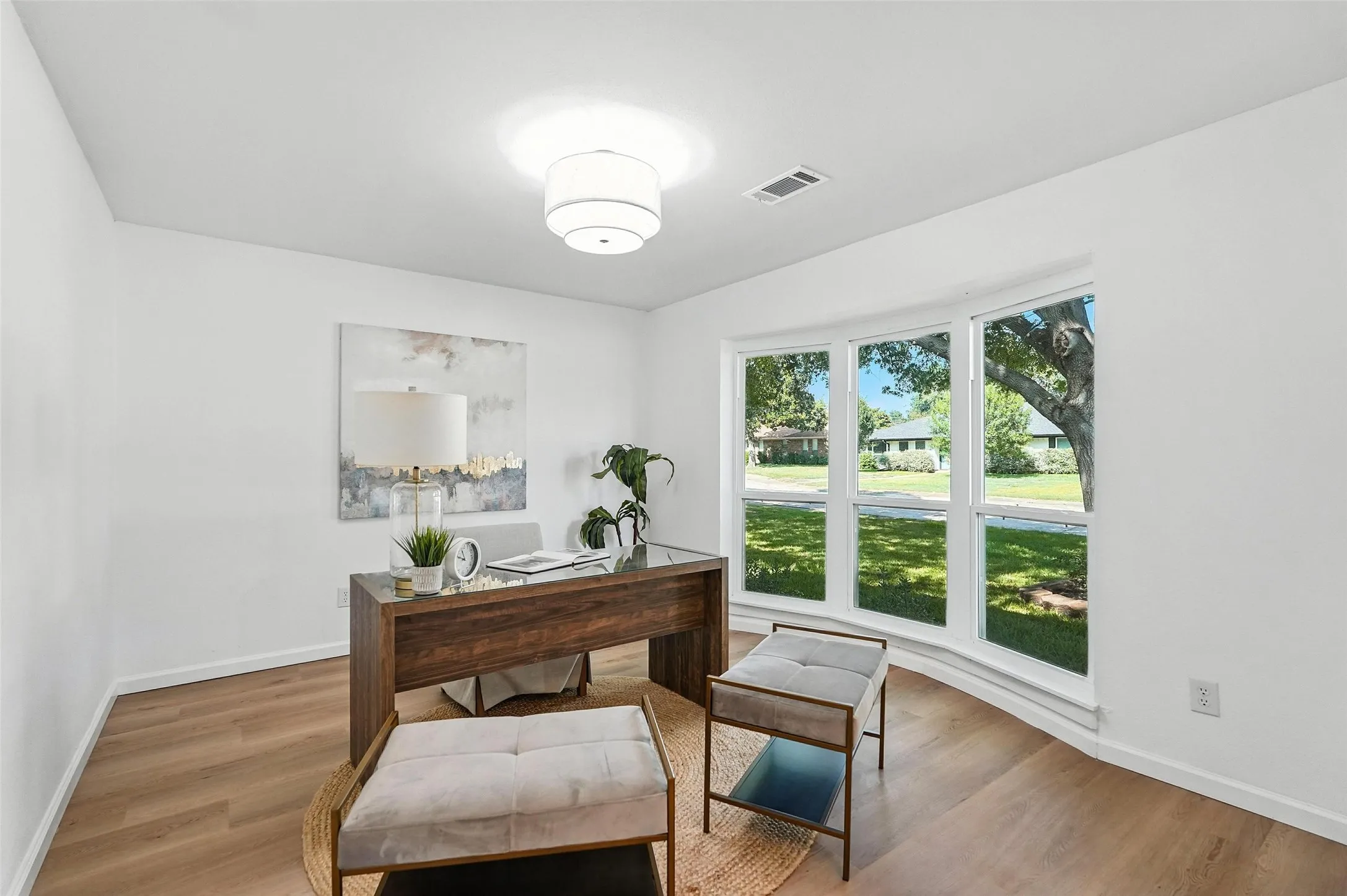 Home office with wood finished floors and​​‌​​​​‌​​‌‌​‌‌​​​‌‌​‌​‌​‌​​​‌​​ baseboards