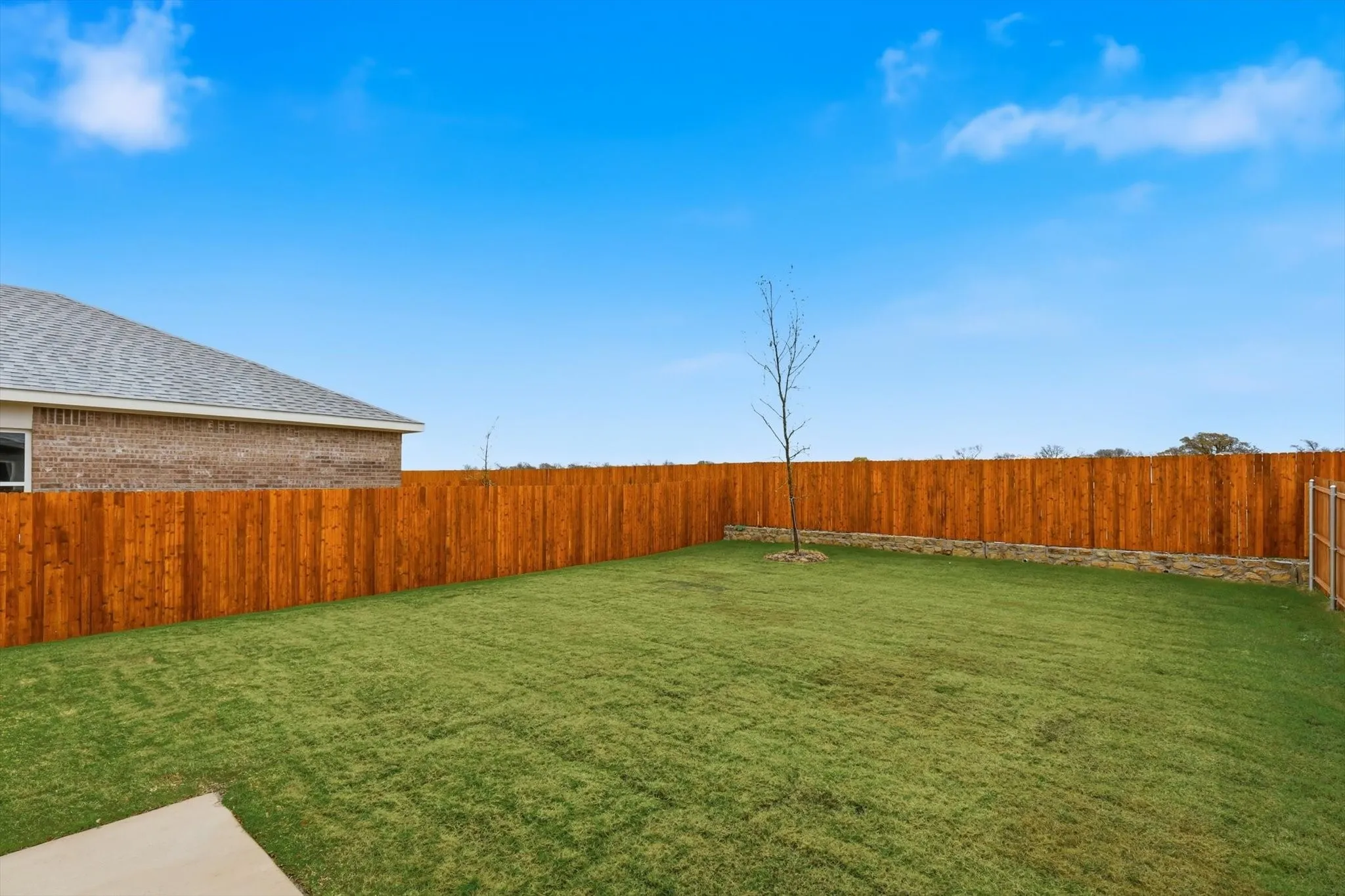 Expansive green lawn providing ample outdoor space