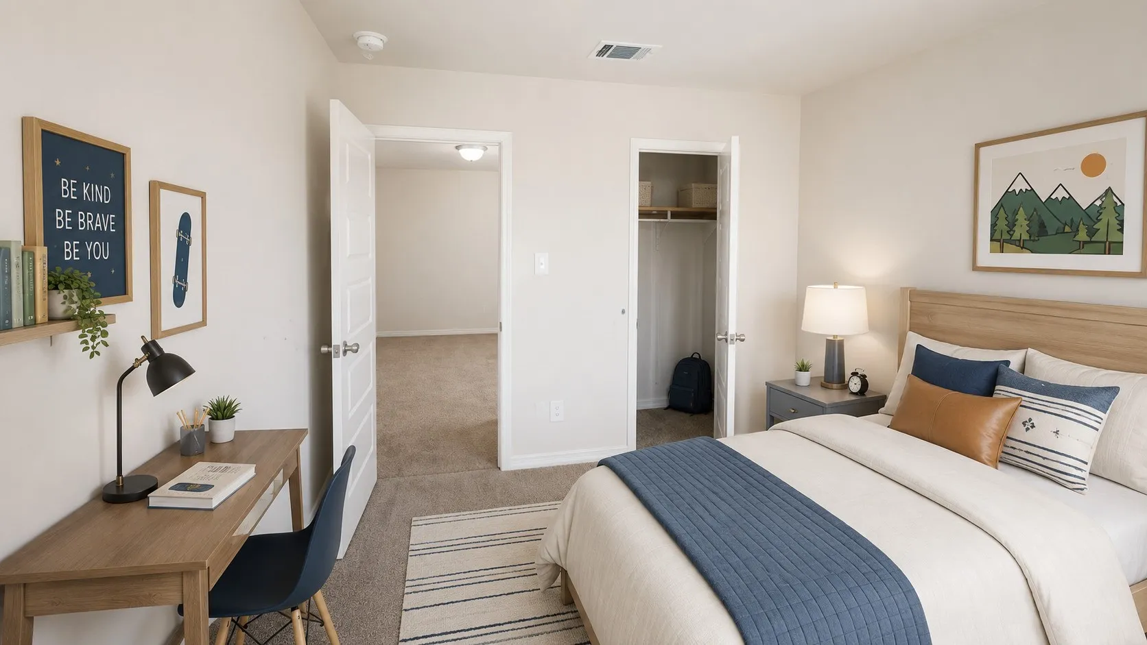 Bedroom featuring light-toned walls, carpet flooring, and a built-in closet with shelving