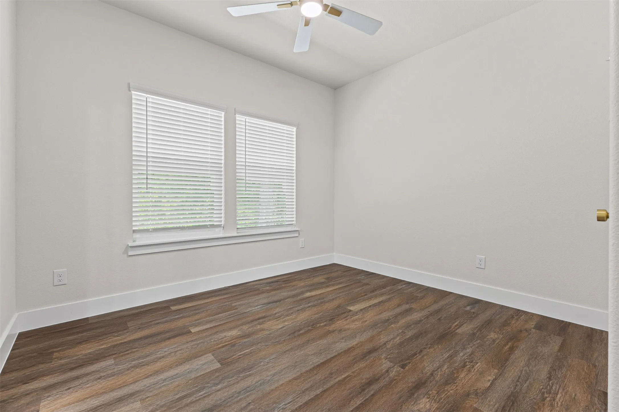Neutral wall color with wood-finish flooring