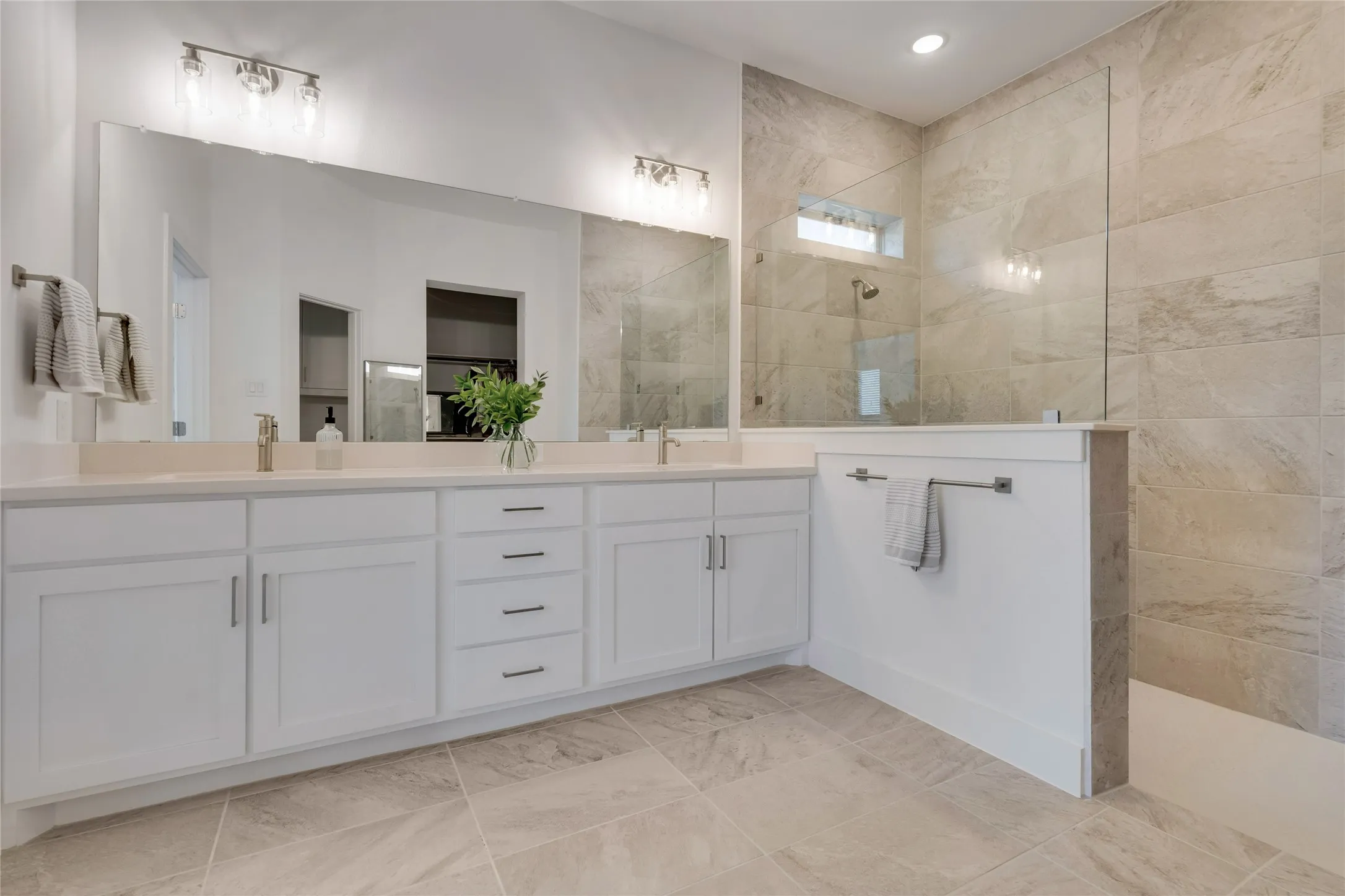 Oversized shower, dual sinks and large walk in closet complete the primary ensuite bath,