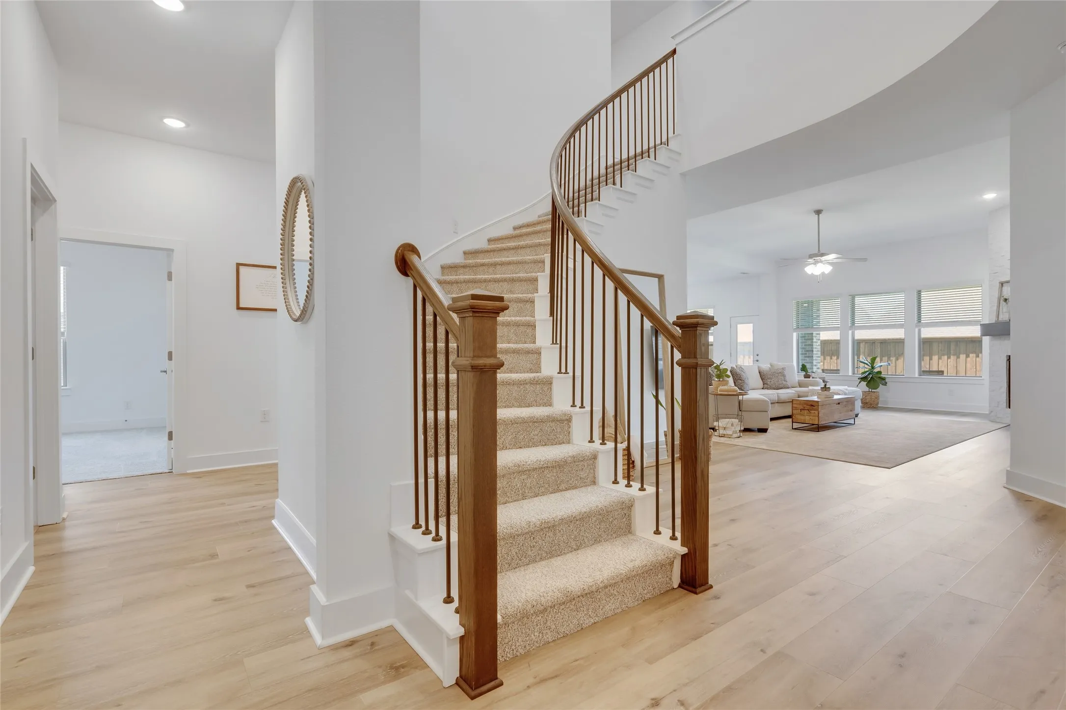 Grand entry with curved staircase.