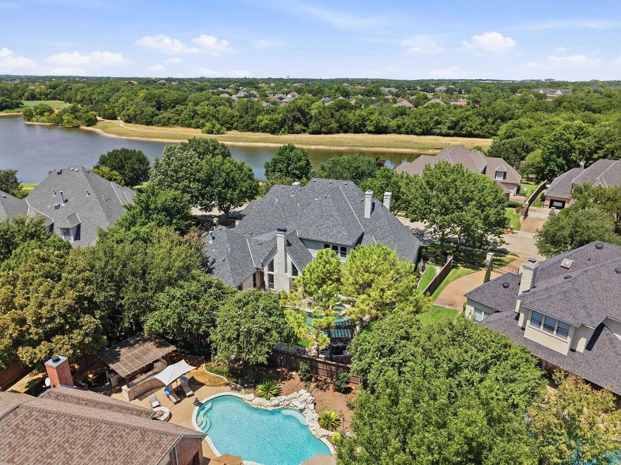 Serene waterside setting with mature trees