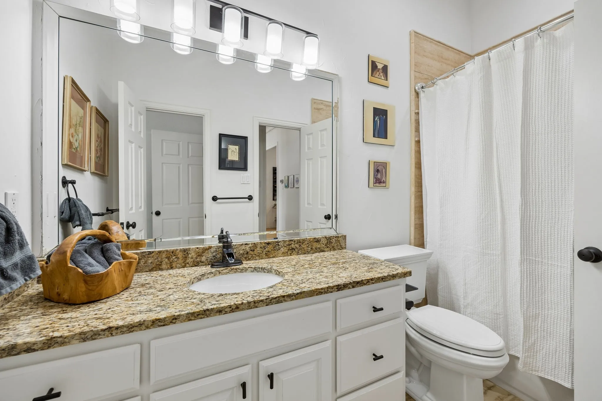 Full bathroom connected to first floor guest room.