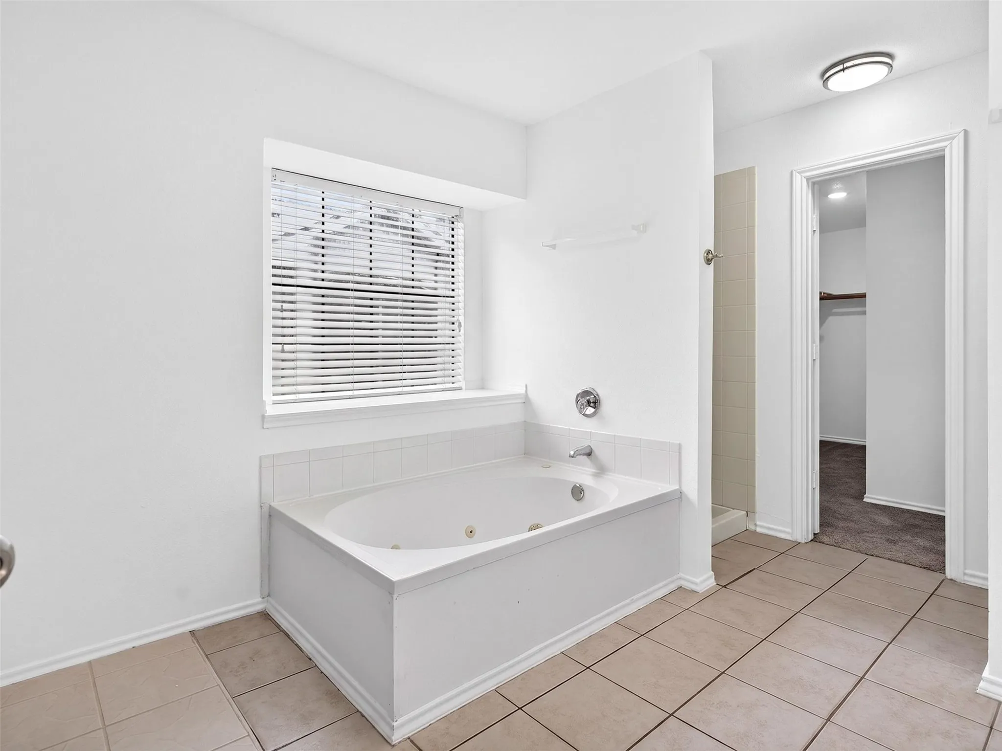 Soaking tub with integrated jets and chrome fixtures
