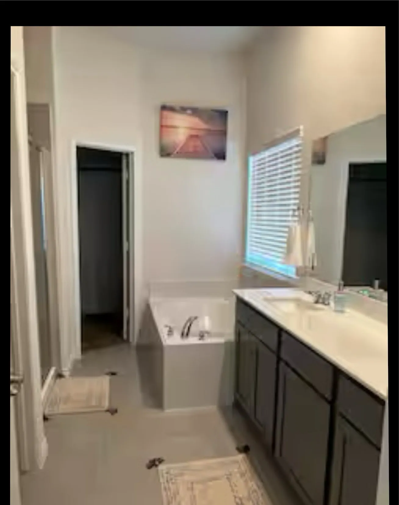 Full bathroom with vanity and a bath