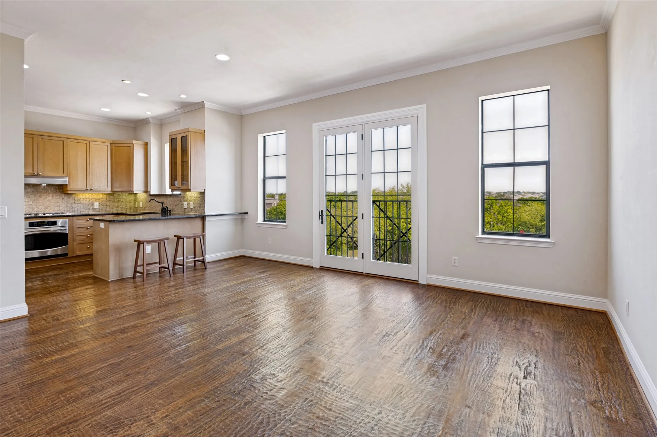 Charming Juliet balcony adds a distinctive architectural touch to the dining room.