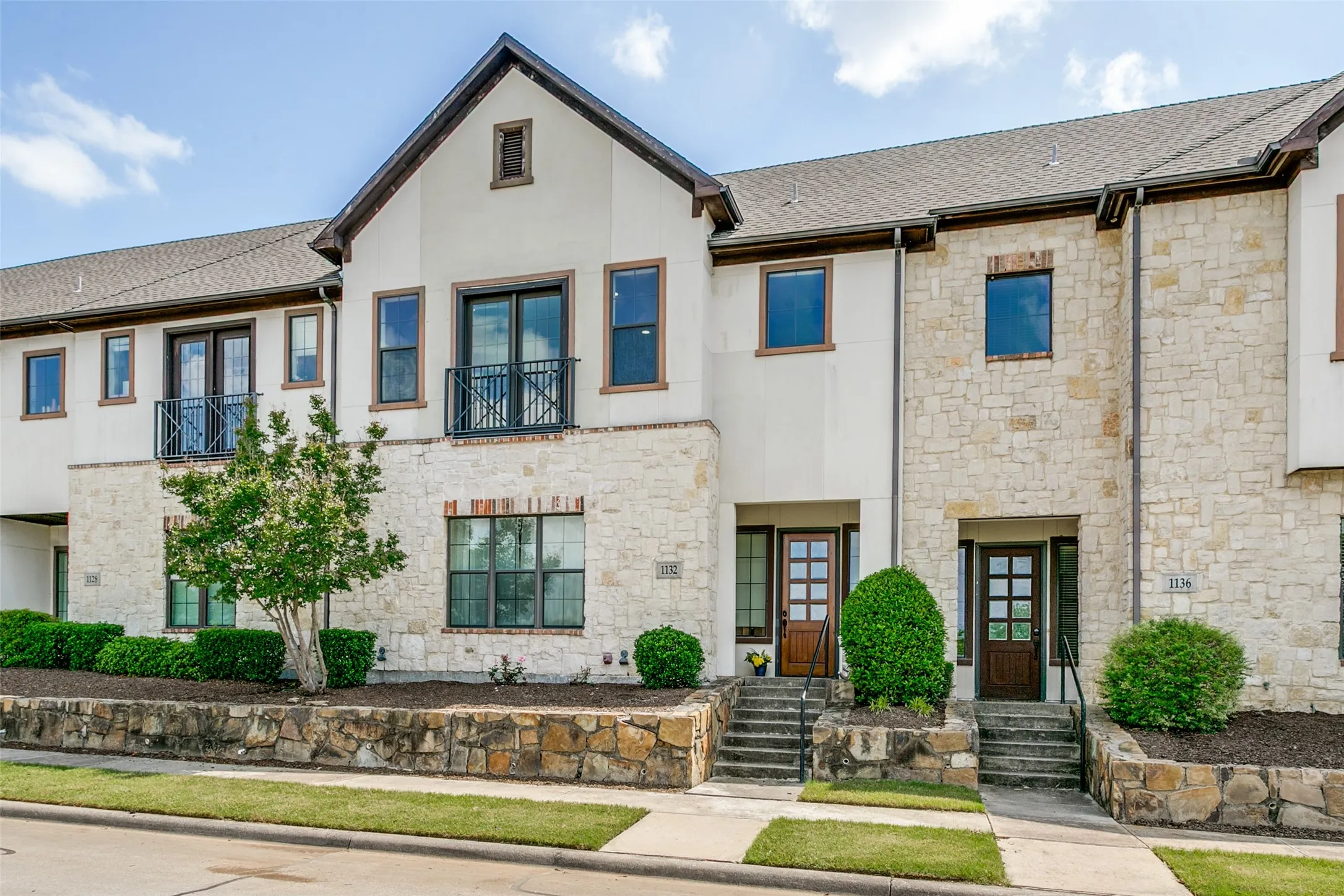 Front elevation highlighting the home’s attractive architecture and well maintained landscaping.
