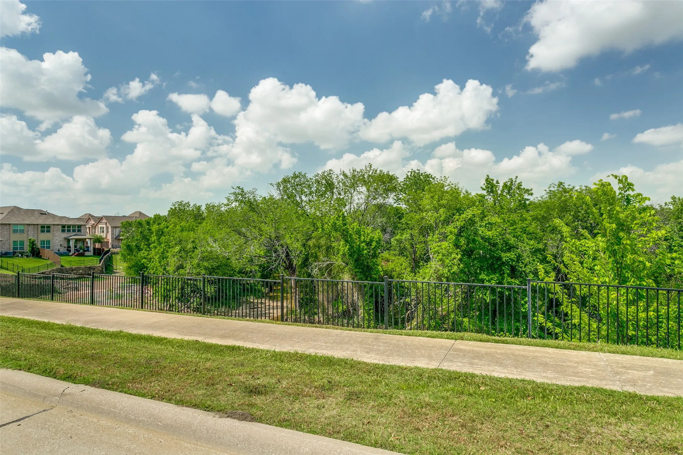 Front facing views of the nearby green space provide a beautiful backdrop and sense of openness.