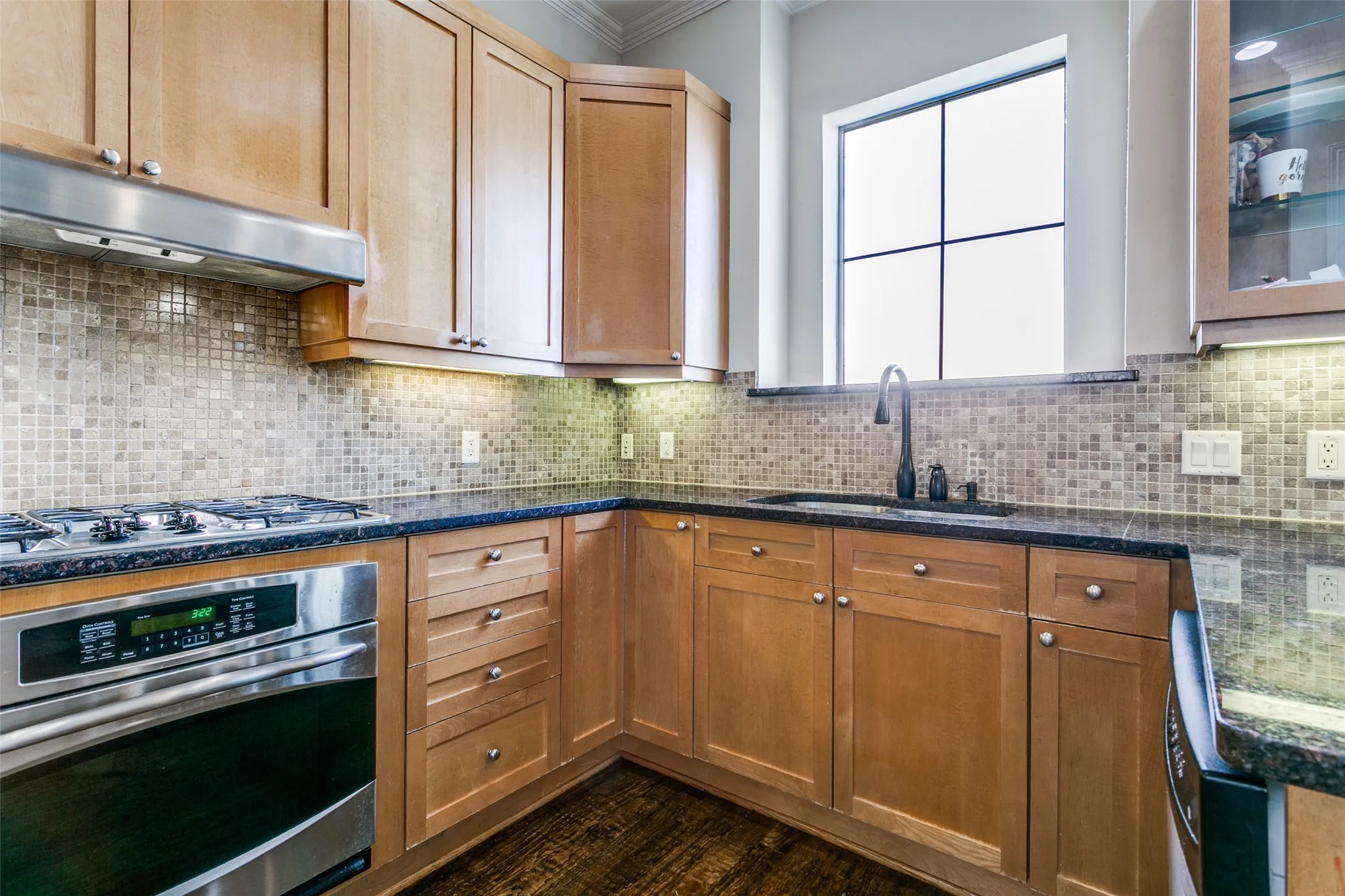 Kitchen featuring a gas range, generous counter space, and a practical layout for preparing meals.