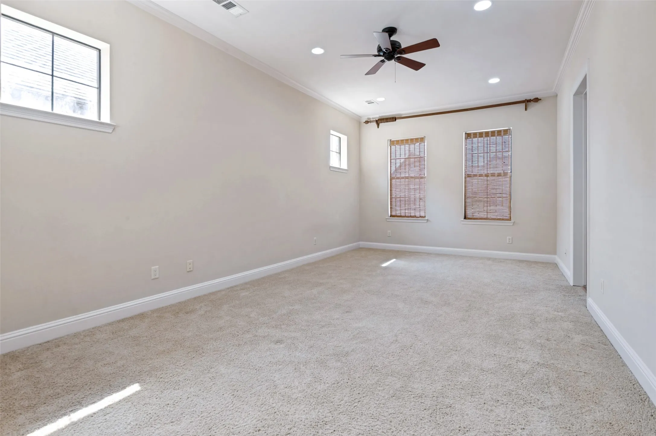 Expansive primary bedroom featuring a flexible layout and a bright, relaxing atmosphere.