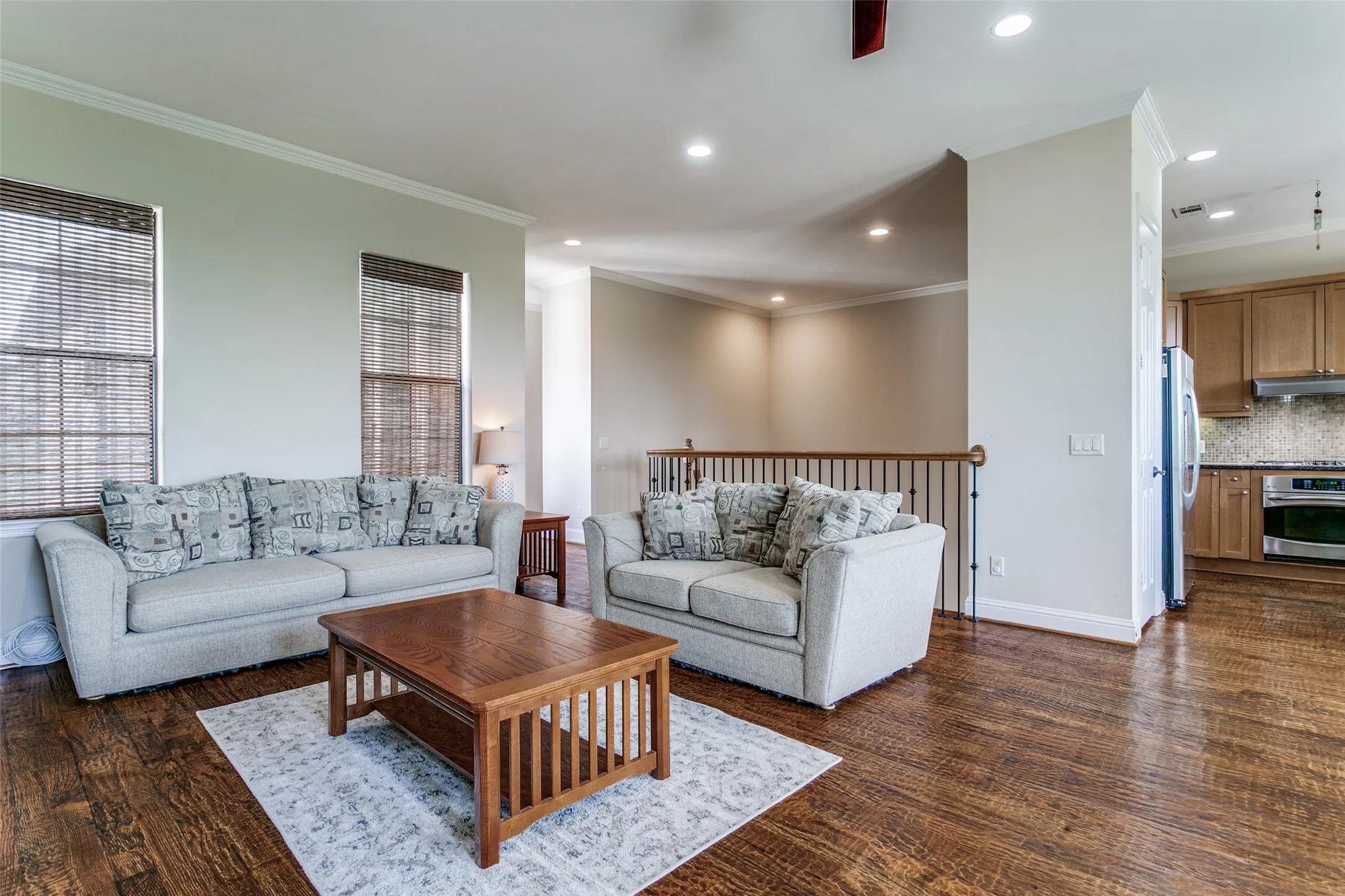 Open living space that flows seamlessly into the dining area and kitchen, creating an inviting setting for everyday living and entertaining.