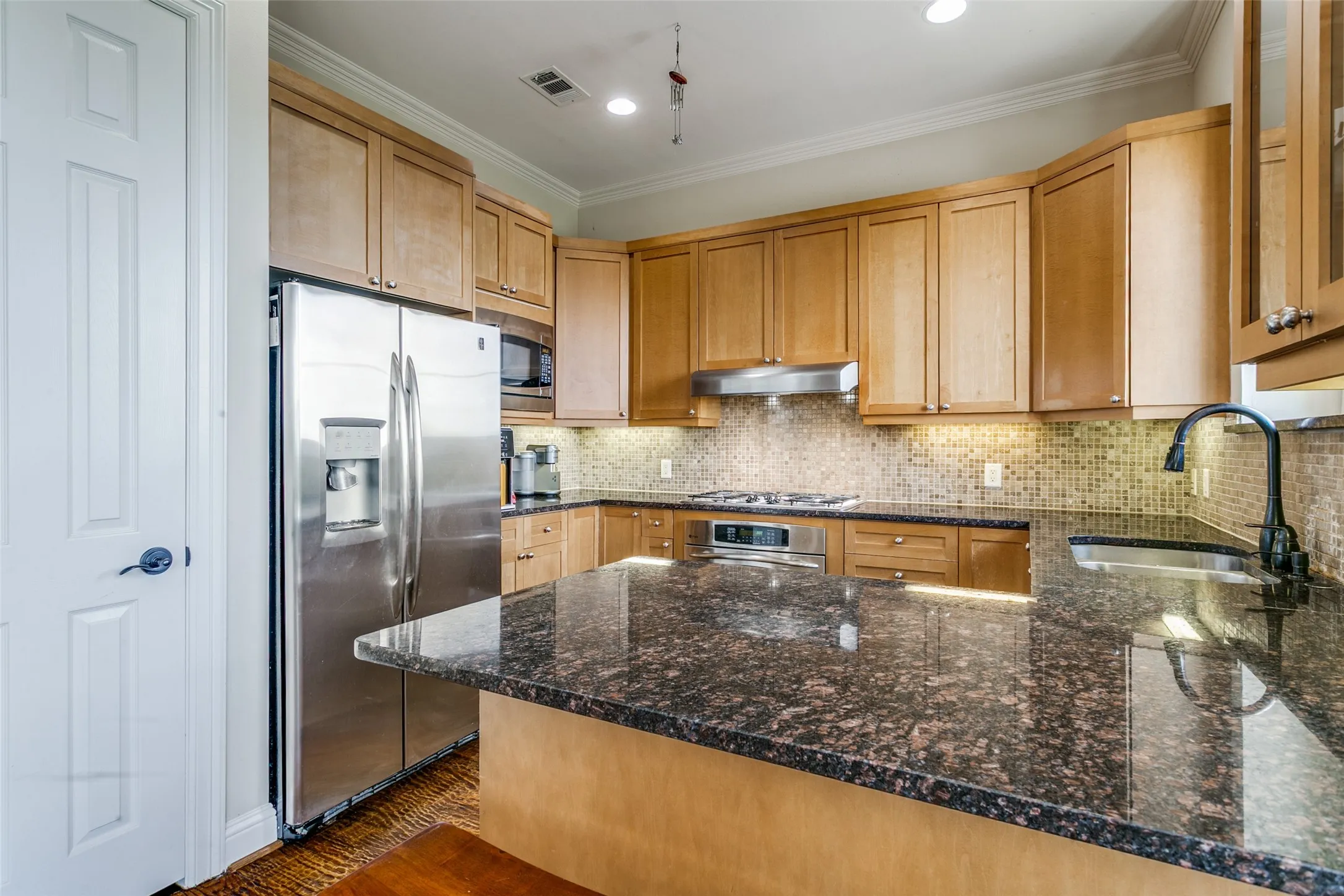 Modern kitchen featuring refreshed finishes, ample storage, and a functional layout designed for everyday cooking.