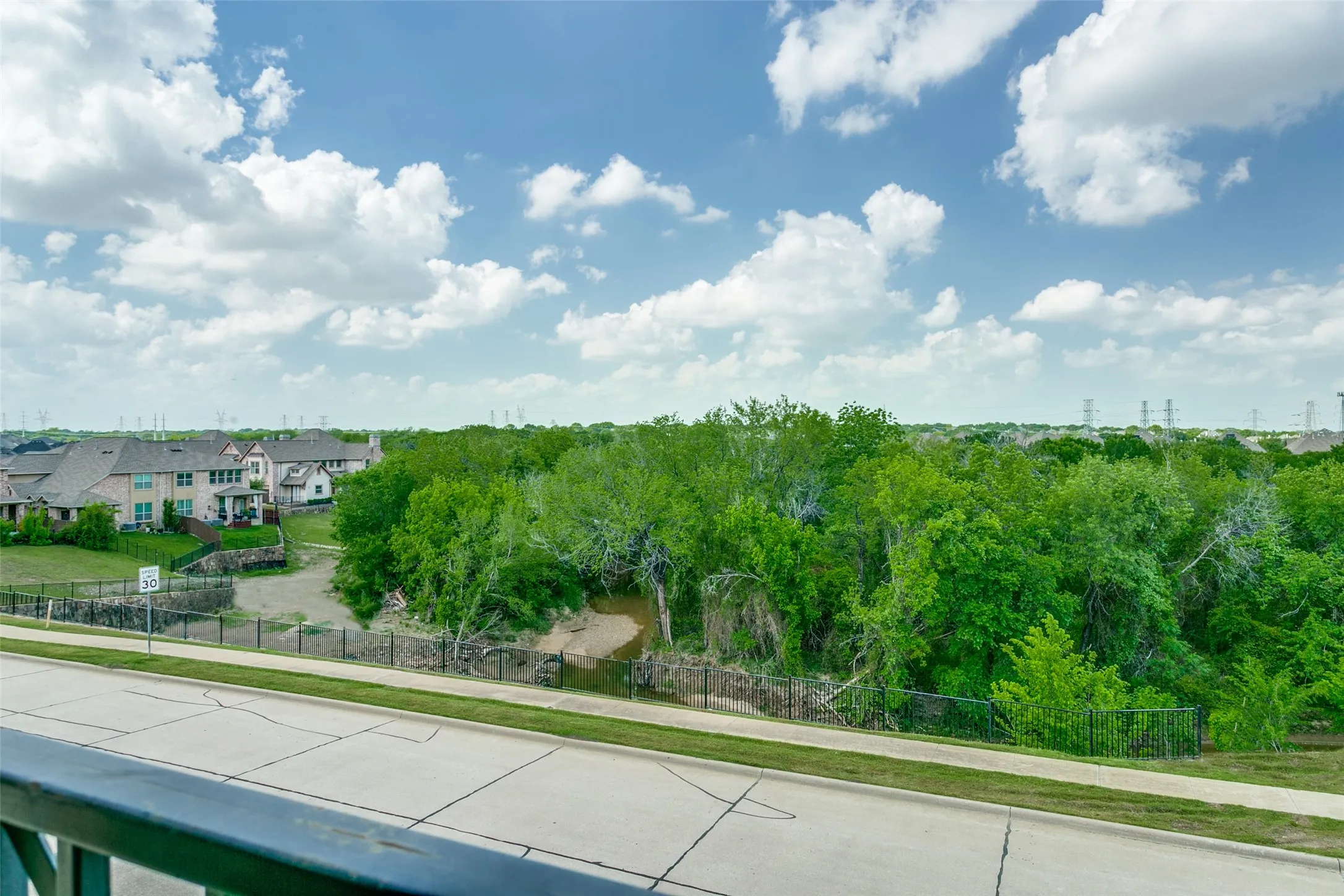 Enjoy scenic views of the surrounding green space from the front the Juliet balcony.