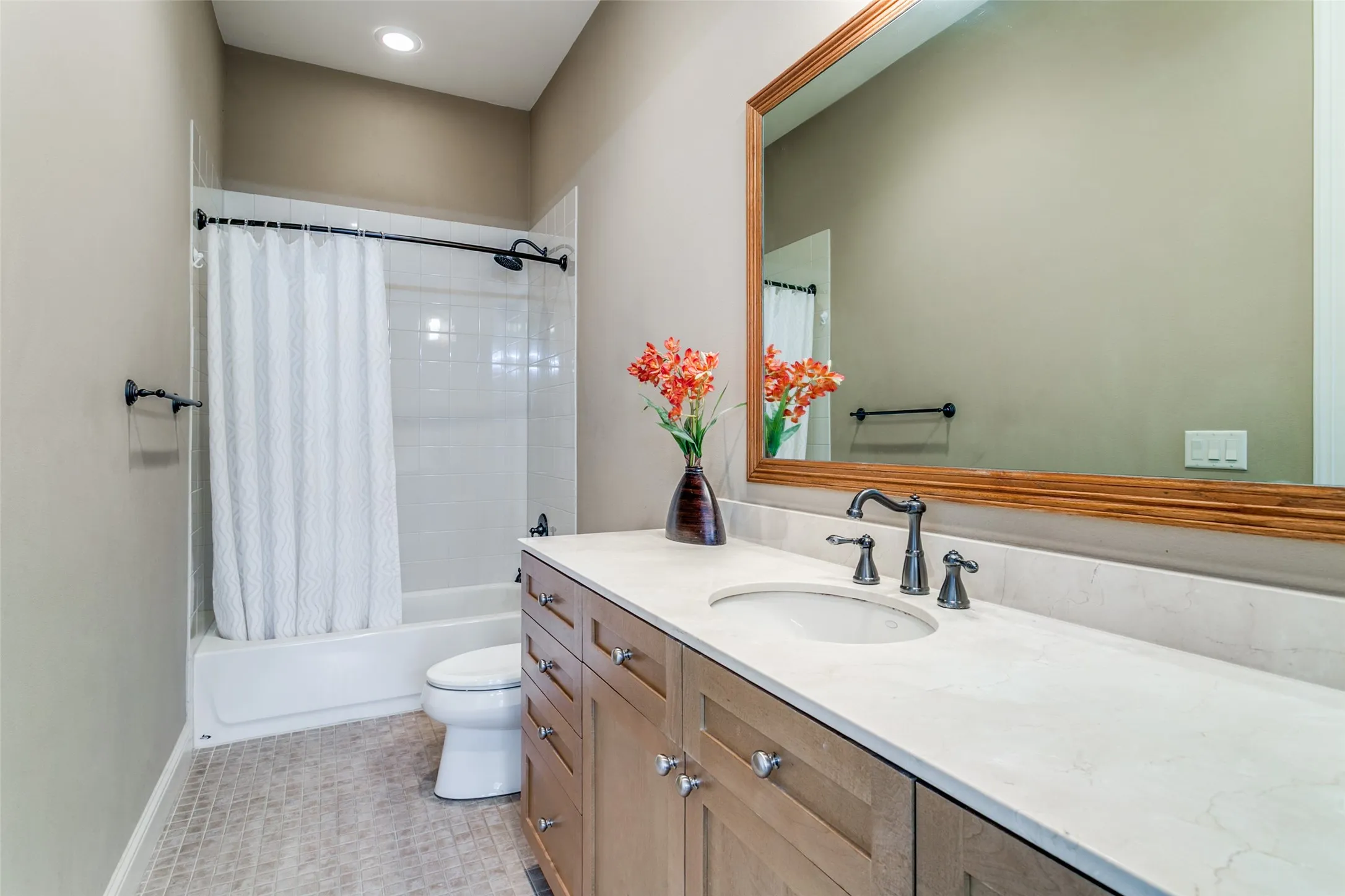 Downstairs bathroom with a spacious vanity offering ample counter space and functionality.