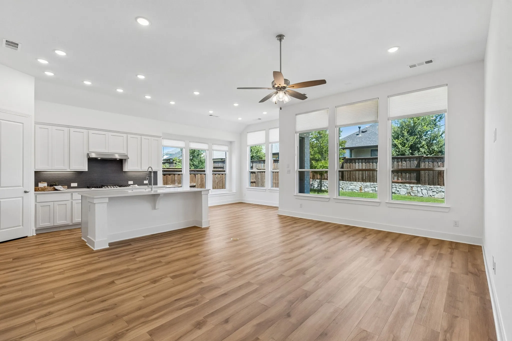 Electric shades on every window lower by the touch of a button for the ultimate privacy