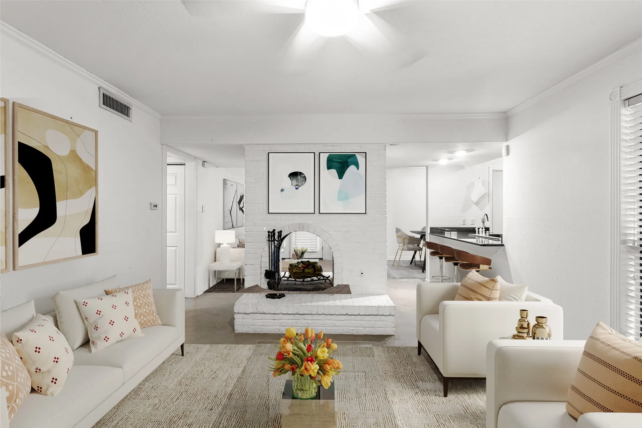 Virtually Staged living area featuring a white brick fireplace with hearth, crown molding, and recessed lighting