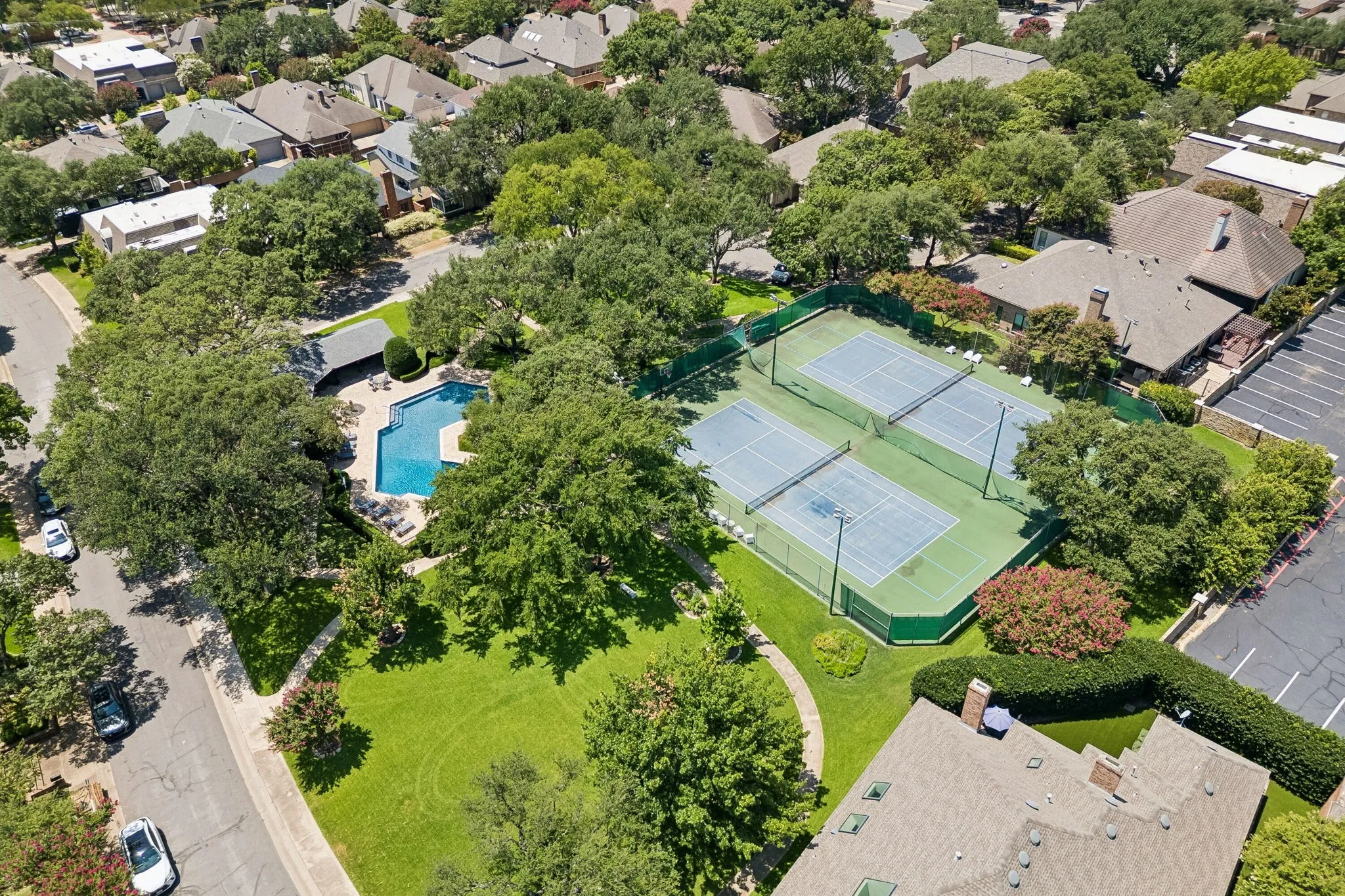 Tennis and pickleball courts are adjacent to the pool and within a few homes from 6015 Shetland.