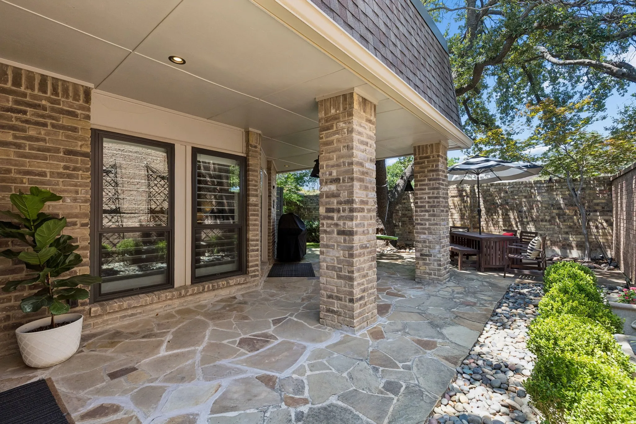 The flagstone patio has ample space for total outdoor living.