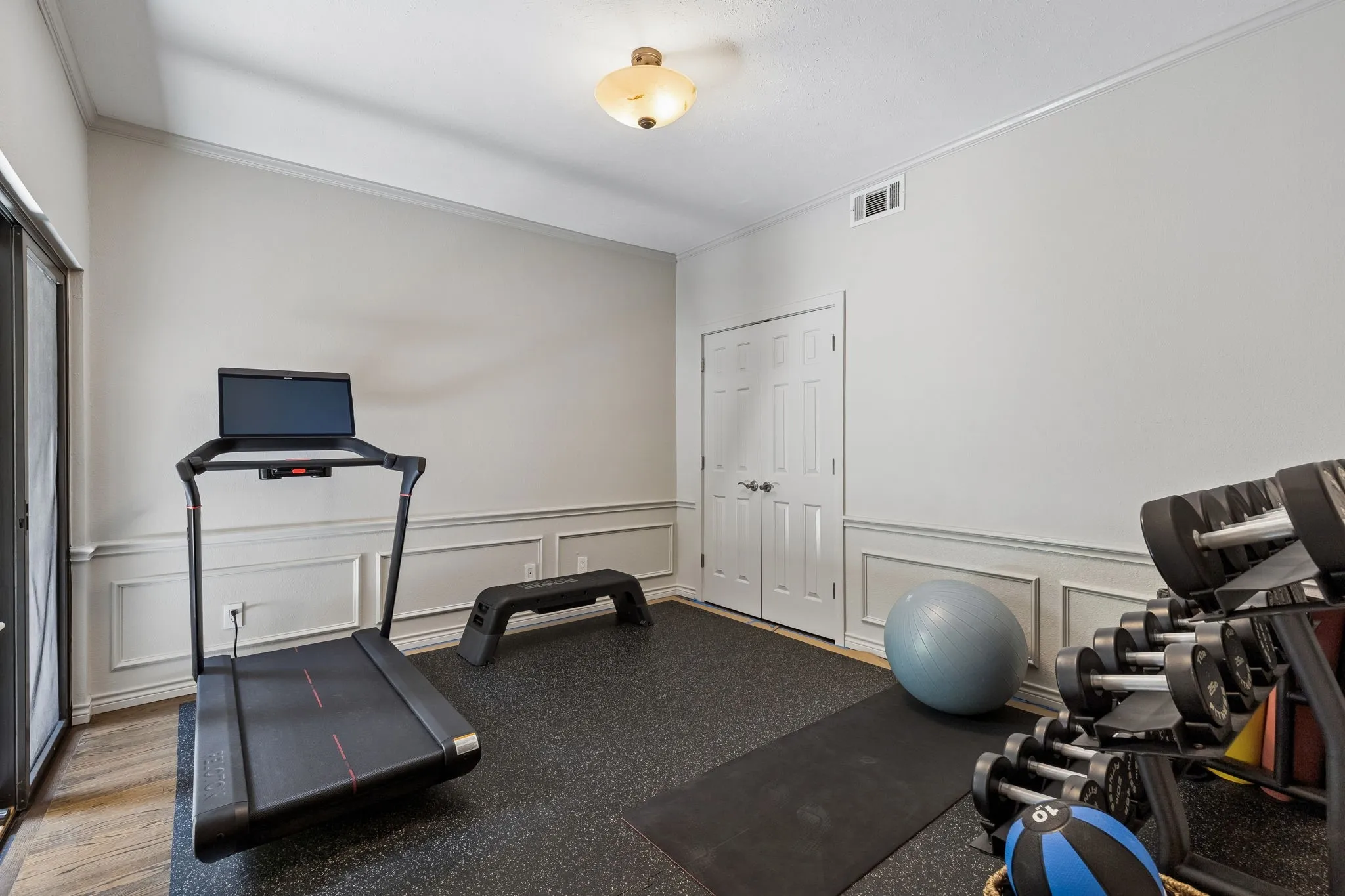 Currently used as an exercise room, but is a great guest room or home office with sliding door to secondary patio.