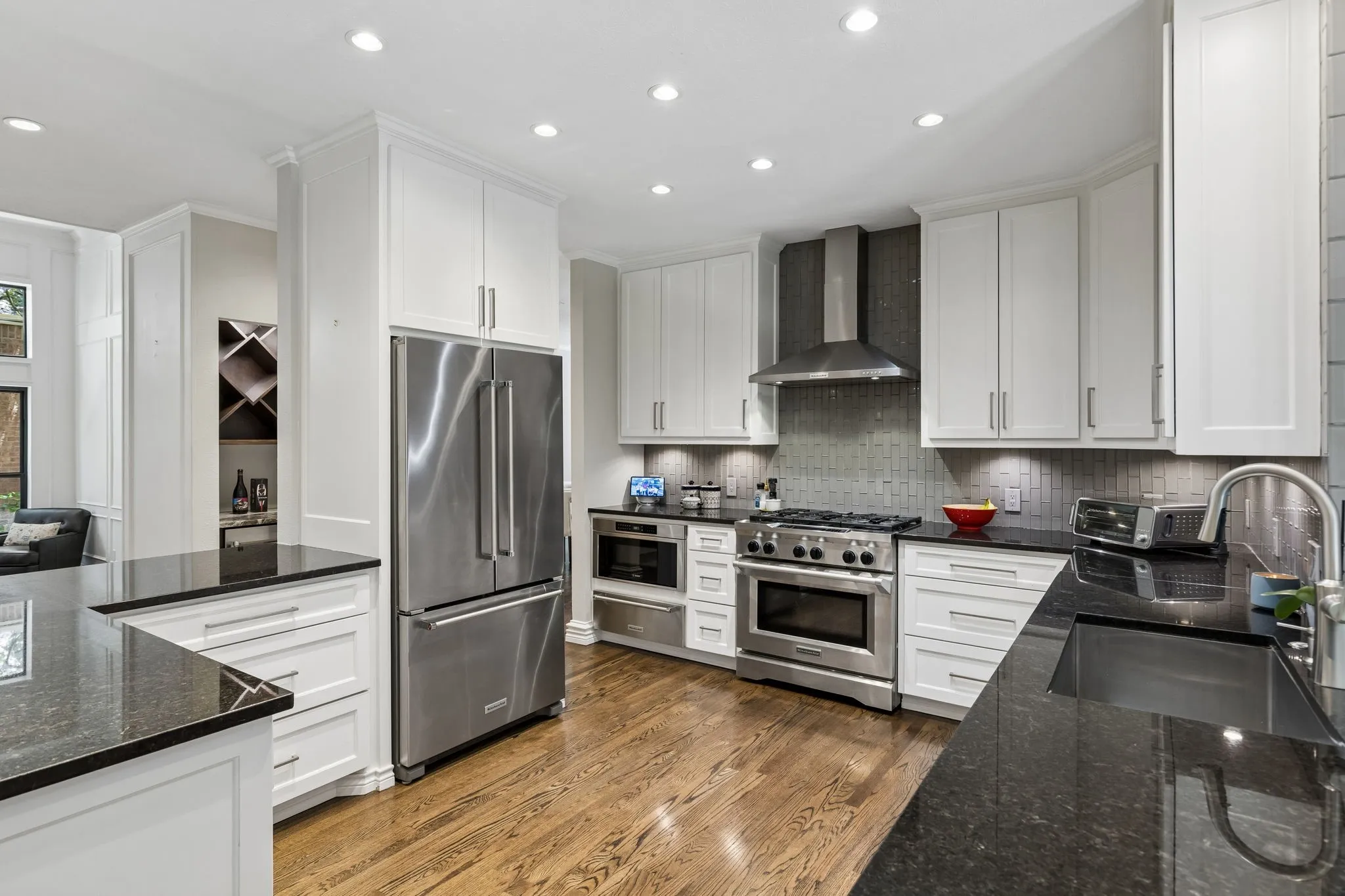The luxury Kitchen Aid range and appliances give the kitchen a luxury vibe. Refrigerator conveys with the home.